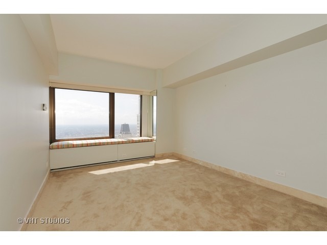 175 East Delaware Place, Unit 6001 Chicago, IL 60611 - Photo 8 of 10 a view of an empty room with a window