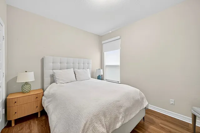 a white toilet and tub sitting next to a bathroom sink