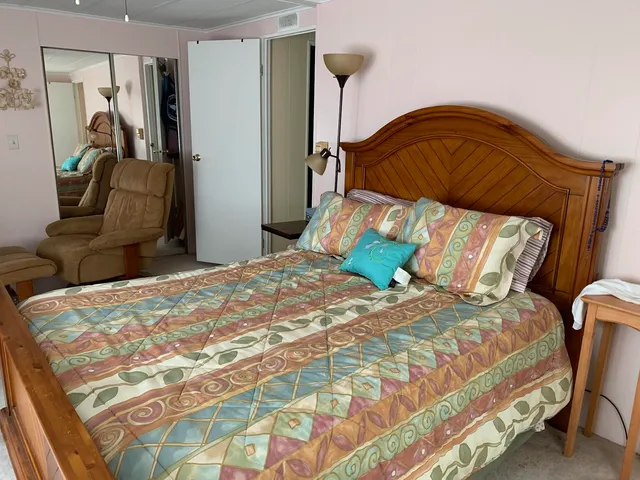 a bathroom with a granite countertop sink and mirror