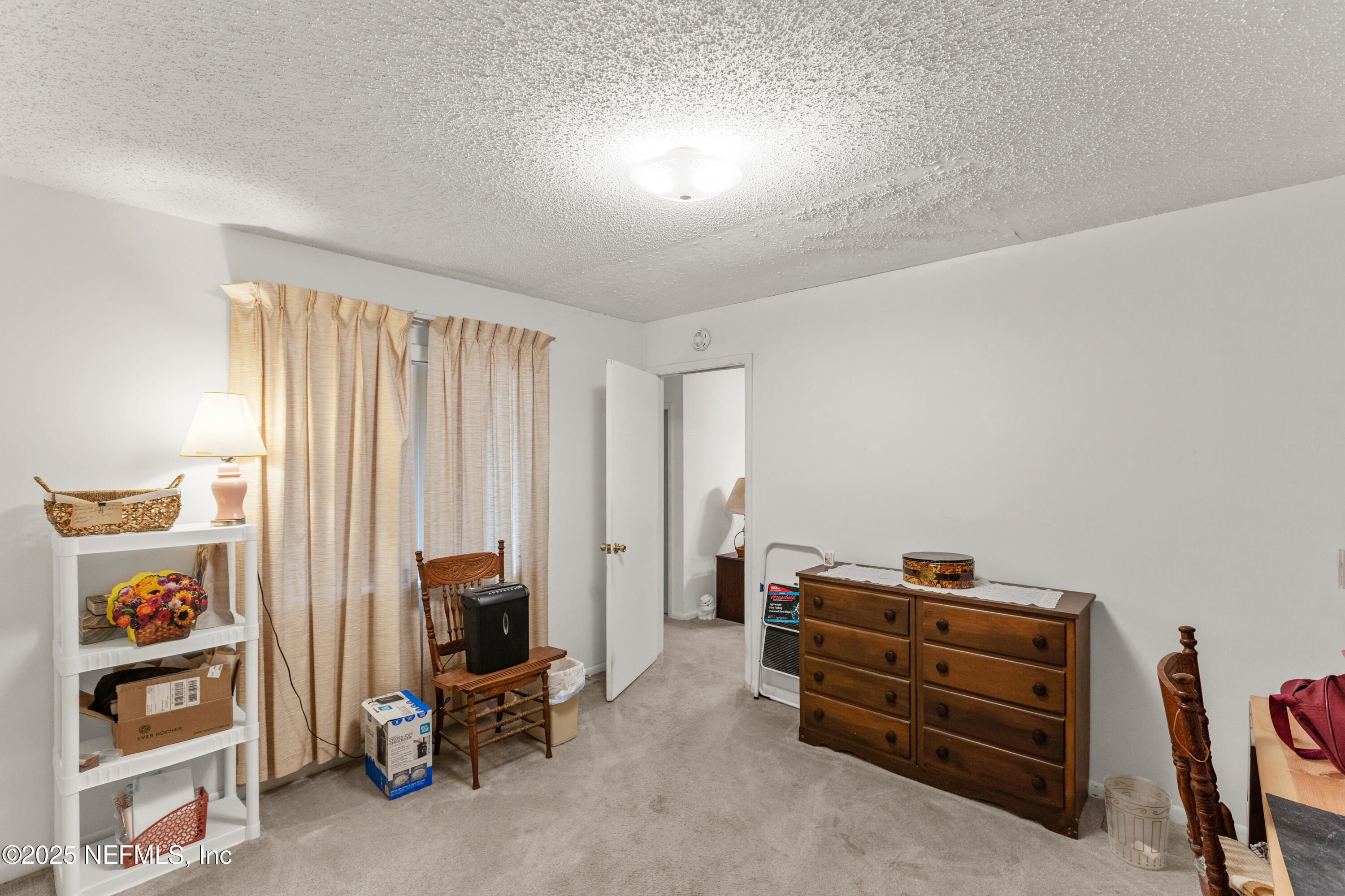 6276 Magnolia Street Keystone Heights, FL 32656 - Photo 25 of 45 a view of a bedroom with workspace and windows
