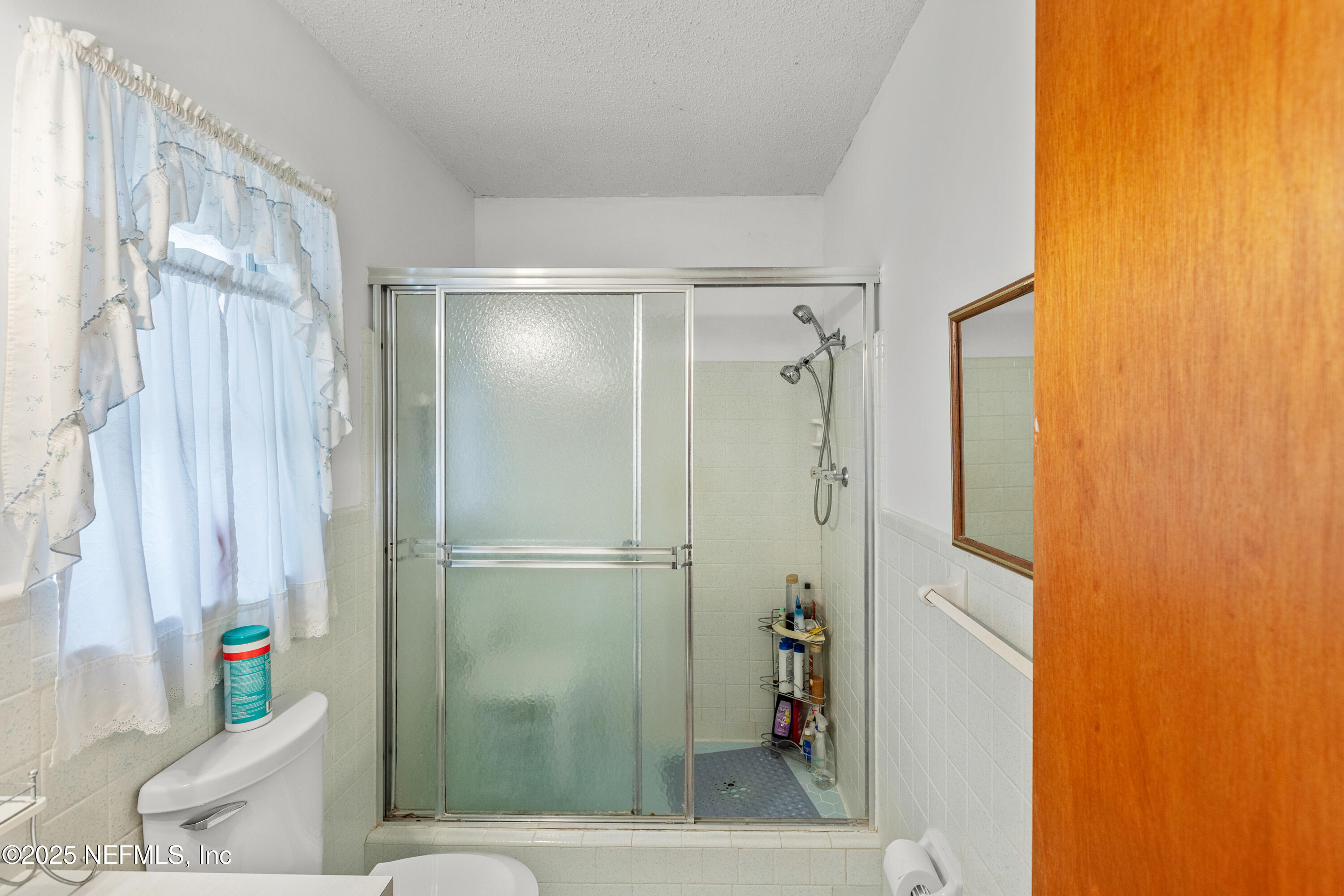 6276 Magnolia Street Keystone Heights, FL 32656 - Photo 30 of 45 a bathroom with a shower and a toilet