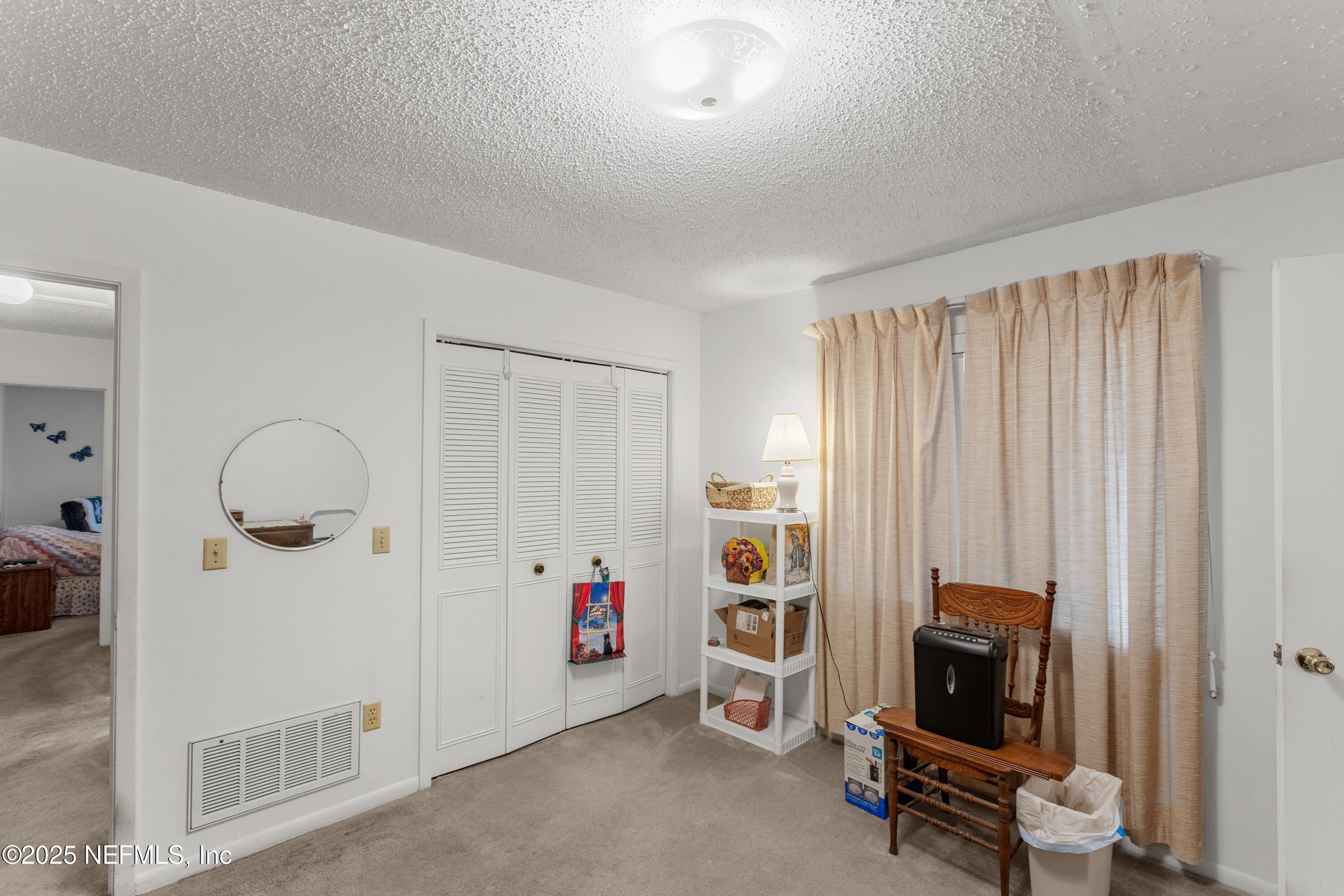 6276 Magnolia Street Keystone Heights, FL 32656 - Photo 32 of 45 a view of room with workspace and a window