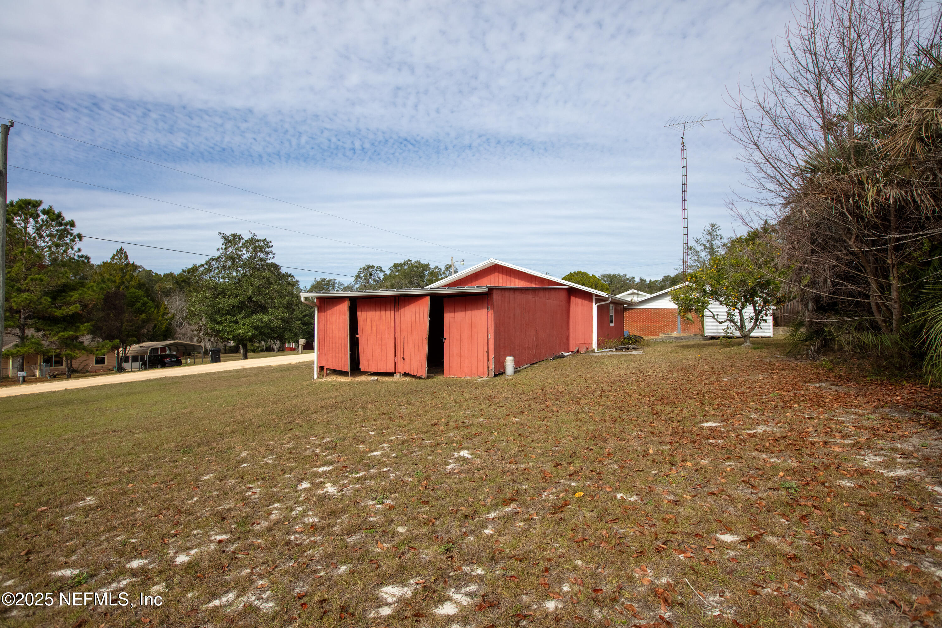6276 Magnolia Street Keystone Heights, FL 32656 - Photo 38 of 45 a house with a yard