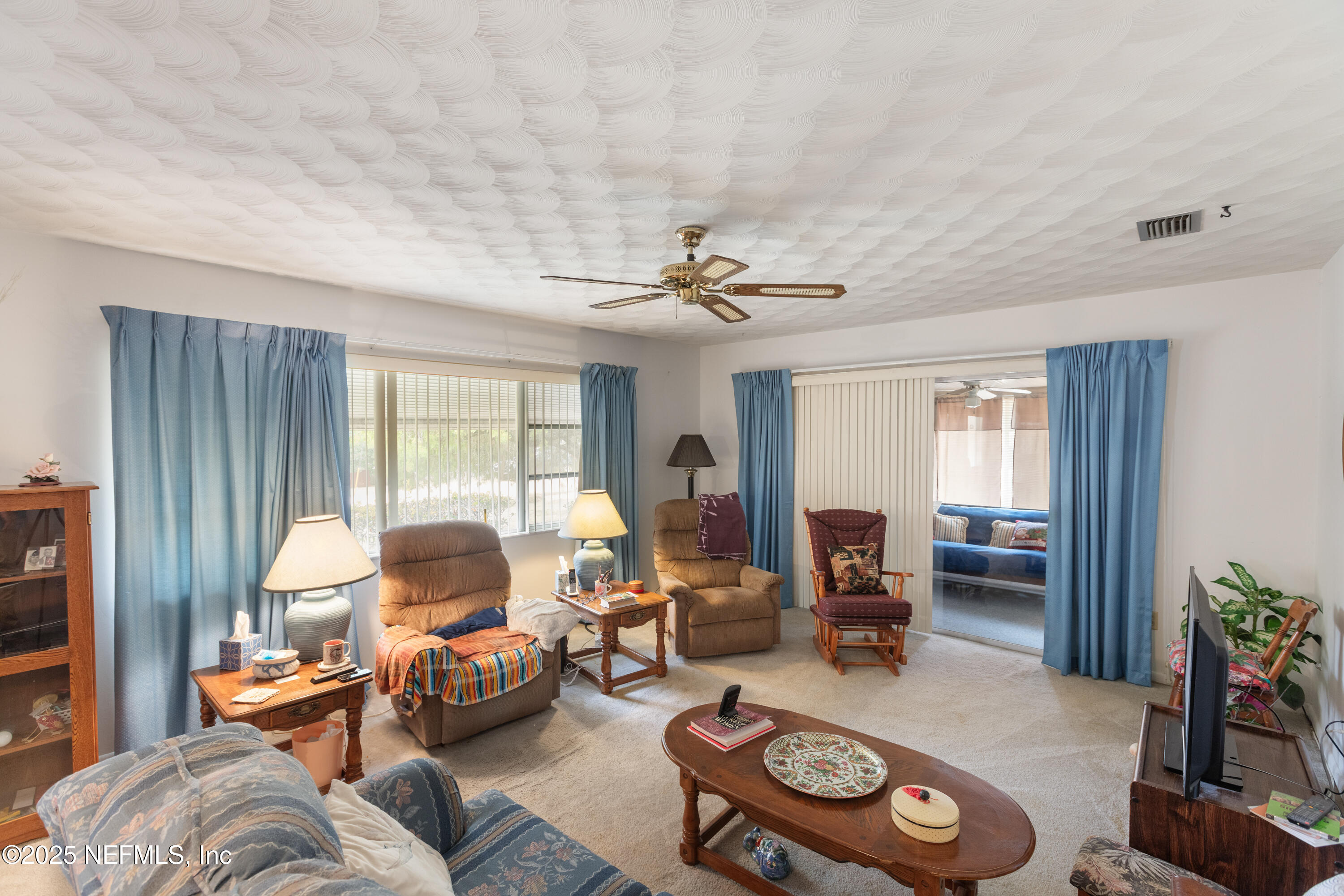 6276 Magnolia Street Keystone Heights, FL 32656 - Photo 5 of 45 a living room with furniture and a large window