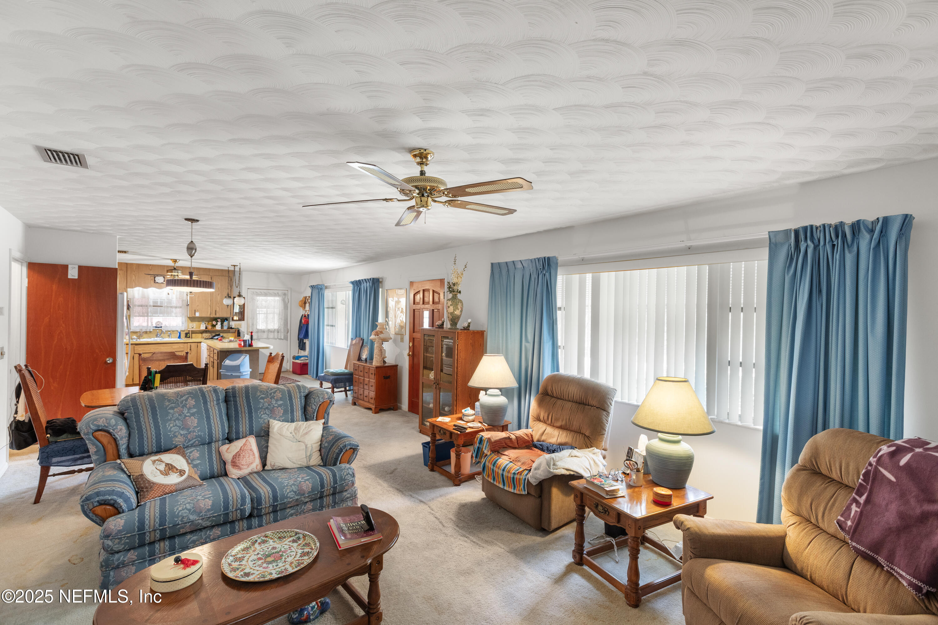 6276 Magnolia Street Keystone Heights, FL 32656 - Photo 6 of 45 a living room with furniture and a large window