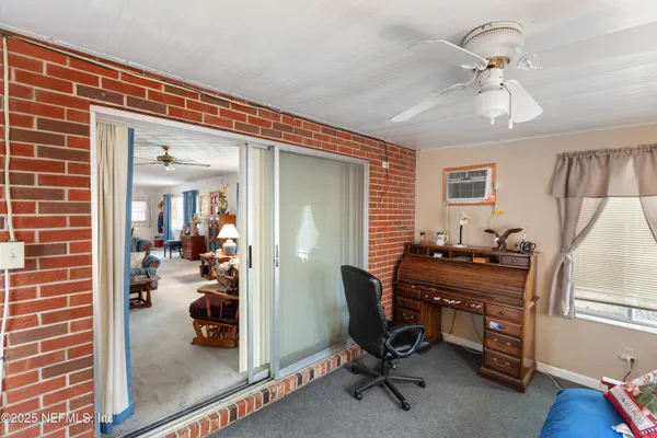 a view of a workspace with furniture and a livingroom