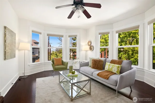 a living room with furniture and a large window