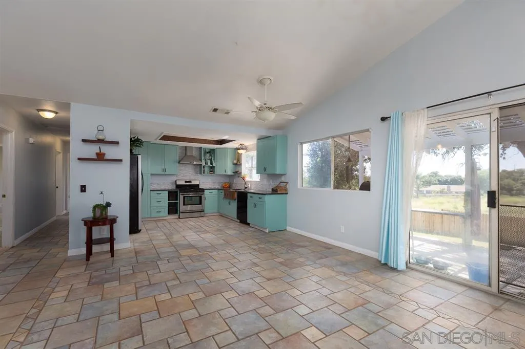 301 Mercedes Road Fallbrook, CA 92028 - Photo 3 of 25 a view of a room with kitchen and windows