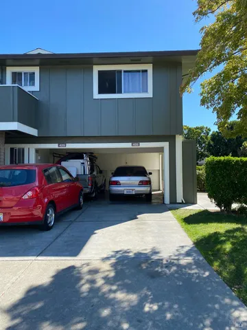 a view of a car parked in front of a house