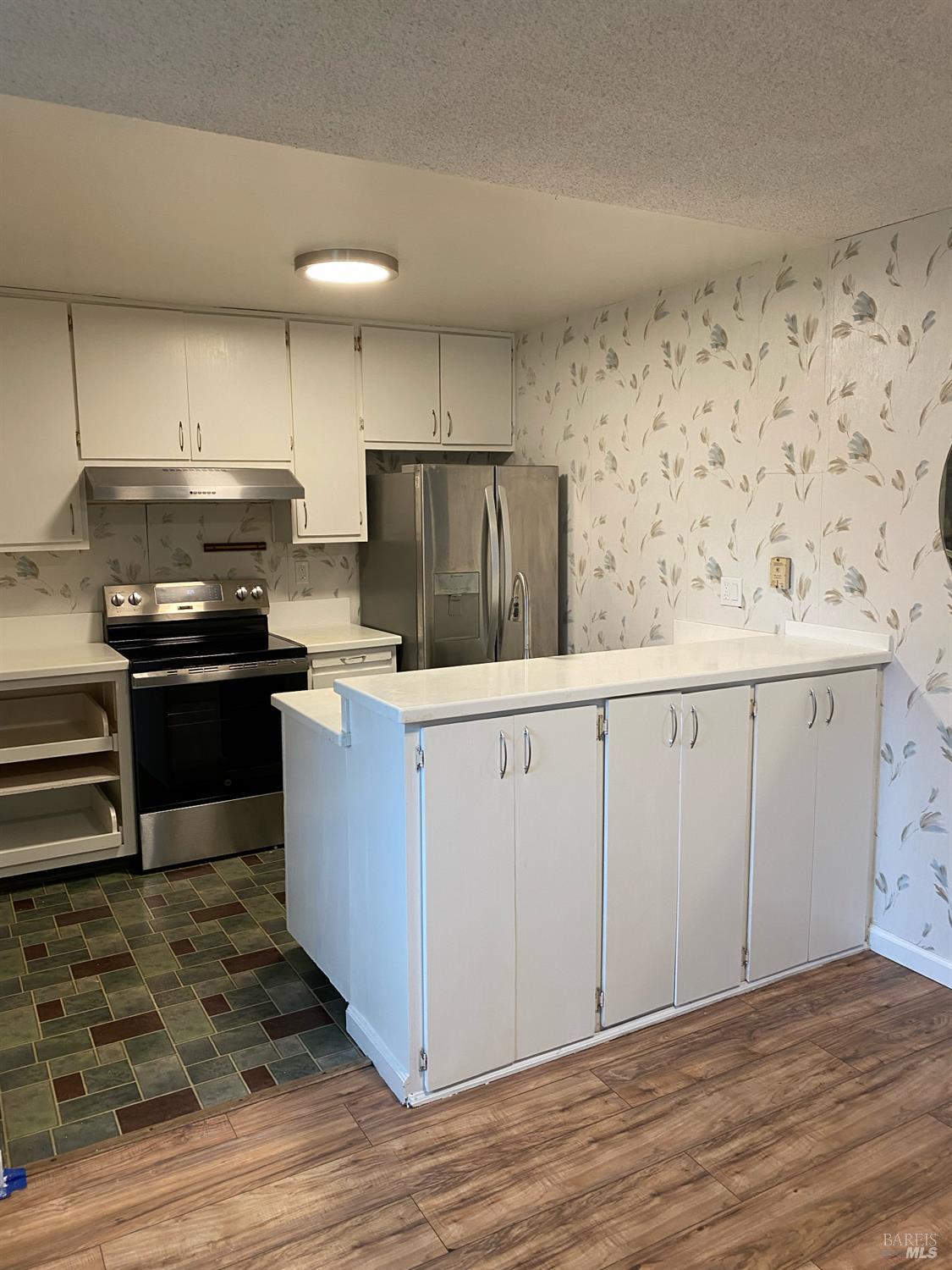 425 Bahia Way San Rafael, CA 94901 - Photo 2 of 18 a kitchen with granite countertop a refrigerator stove and sink