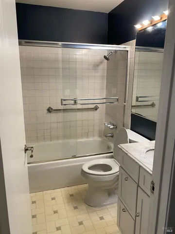a bathroom with a shower and a toilet