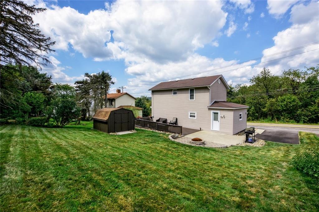 358 Oak Road Gibsonia, PA 15044 - Photo 21 of 22 Rear Yard w/Concrete Pad, Fire Pit & Wood Deck & Shed.