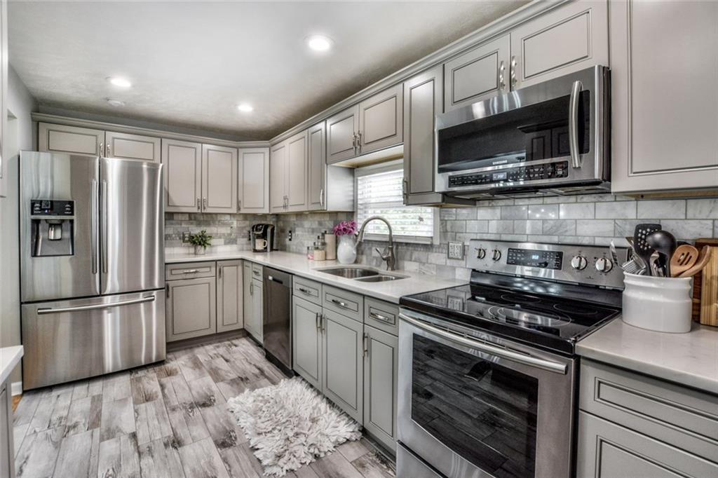 358 Oak Road Gibsonia, PA 15044 - Photo 5 of 22 Kitchen w/Ceramic Tile Flooring, New Solid Wood & Soft Close Cabinets, Cortez Countertop, Backsplash, Under Cabinet Lighting, New Stainless Appliances & Recessed Lighting.