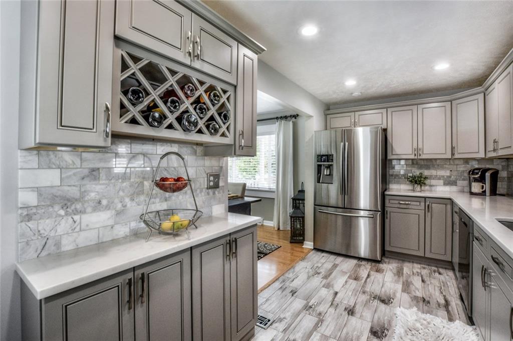 358 Oak Road Gibsonia, PA 15044 - Photo 6 of 22 Kitchen w/Ceramic Tile Flooring, New Solid Wood & Soft Close Cabinets, Cortez Countertop, Backsplash, Under Cabinet Lighting, New Stainless Appliances & Recessed Lighting