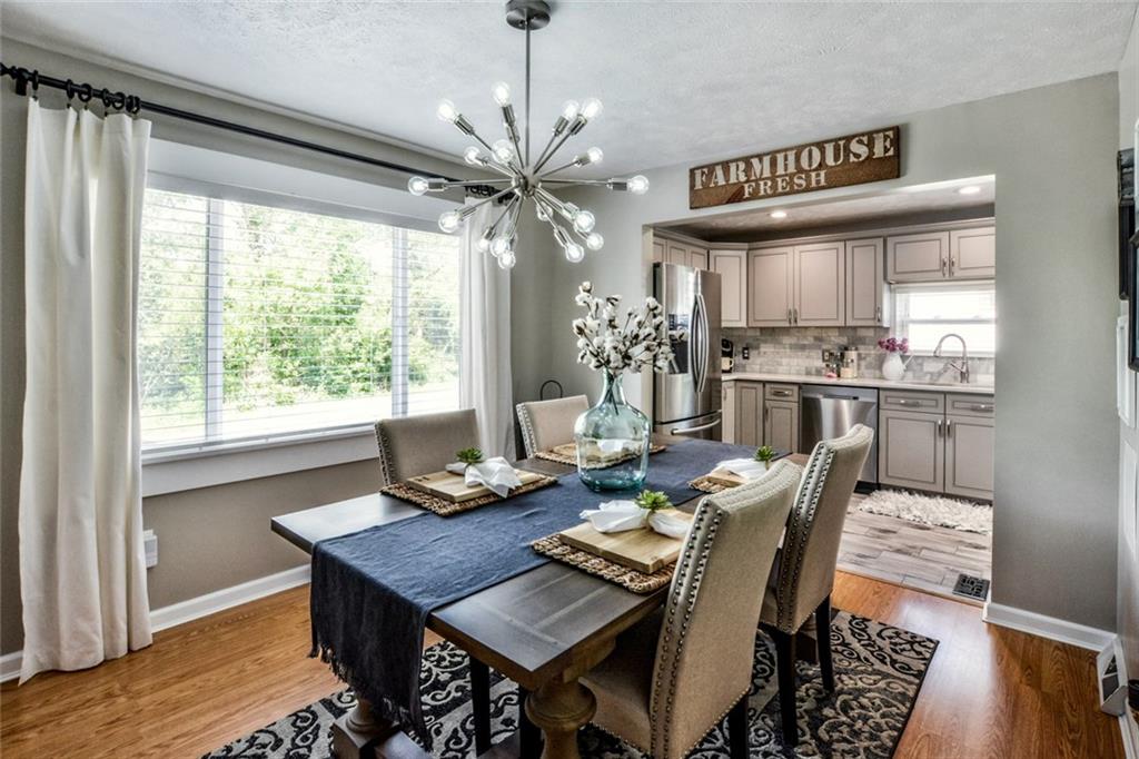 358 Oak Road Gibsonia, PA 15044 - Photo 7 of 22 Dining Room w/ New Eliminate Flooring, Newly Painted & New Window.