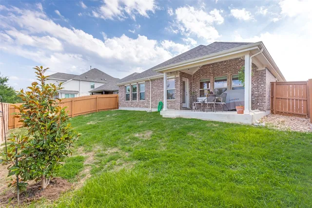 a front view of house with yard and porch