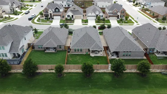 an aerial view of a house with a garden
