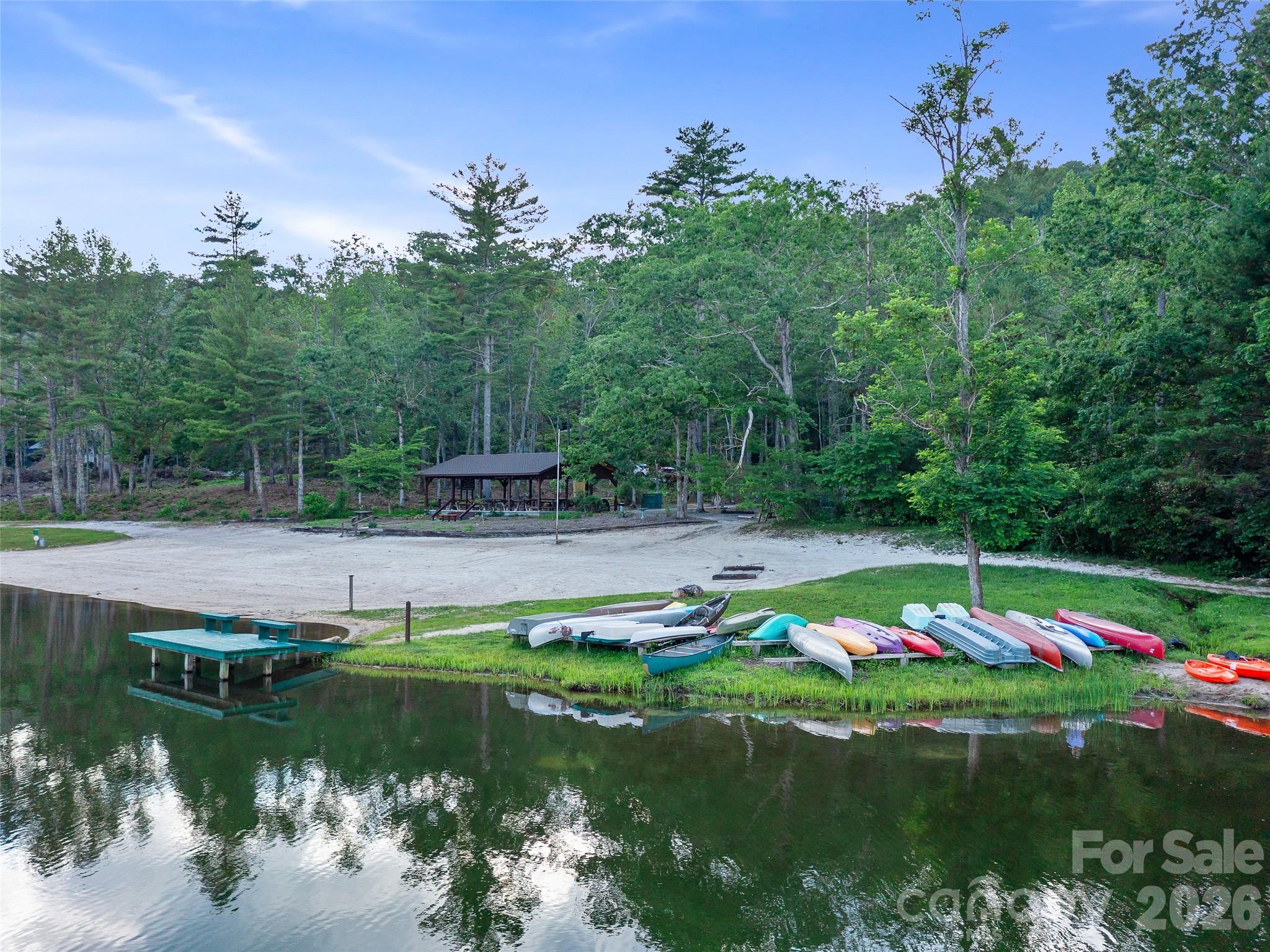 142 Wildflower Road Spruce Pine, NC 28777 - Photo 41 of 46 a view of a lake with houses