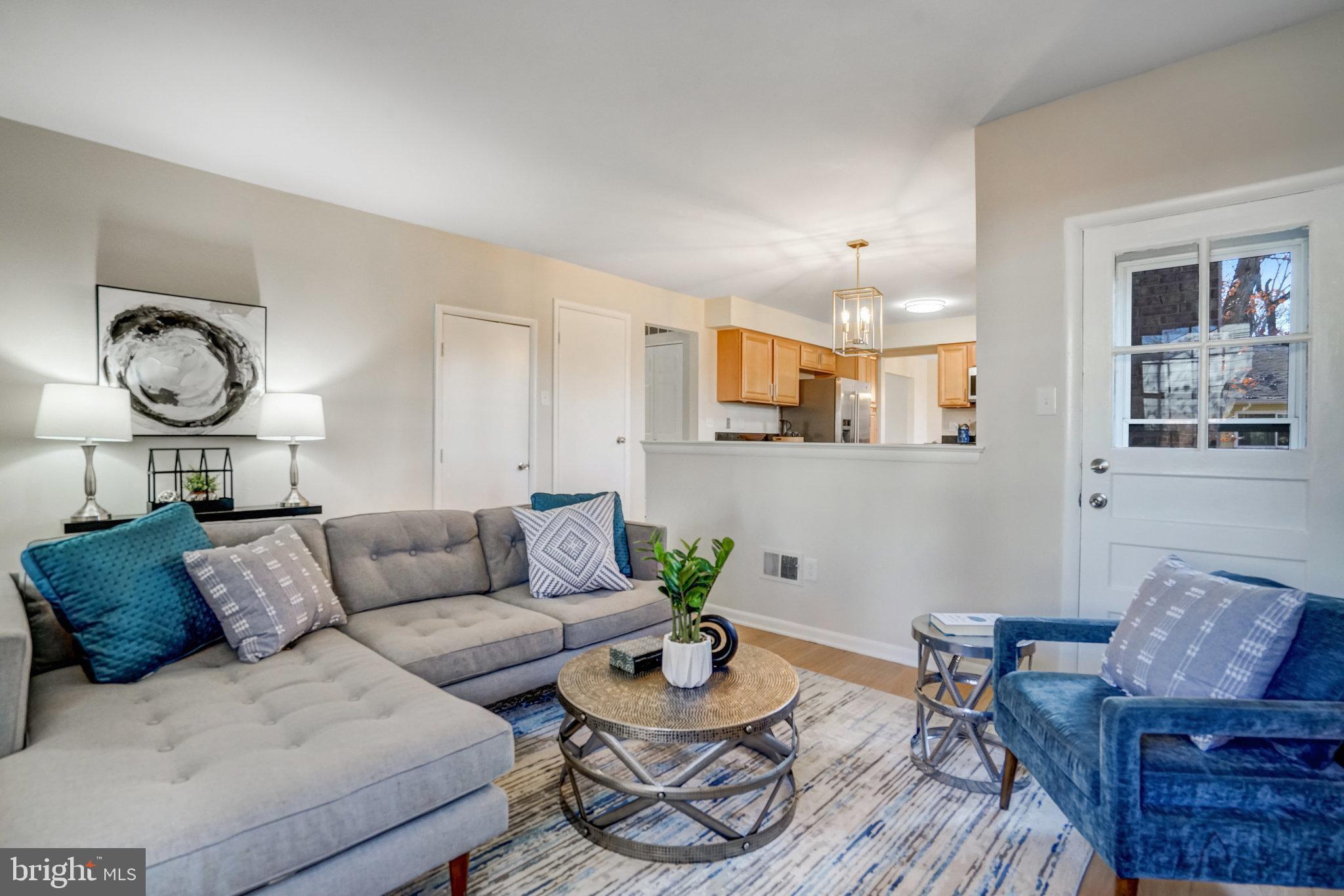 6002 Sherborn Lane Springfield, VA 22152 - Photo 24 of 52 a living room with furniture and a wooden floor