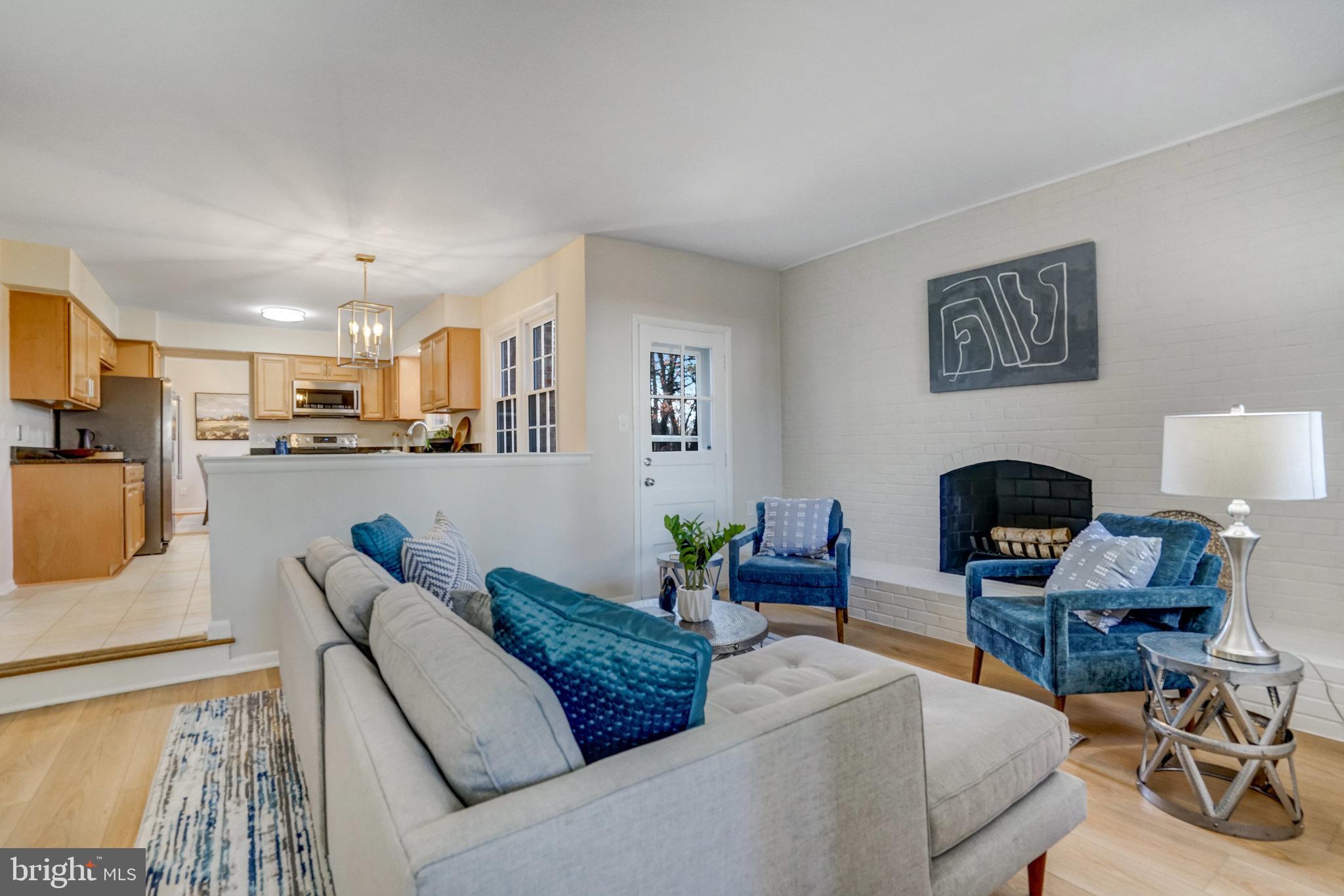 6002 Sherborn Lane Springfield, VA 22152 - Photo 25 of 52 a living room with furniture and a fireplace