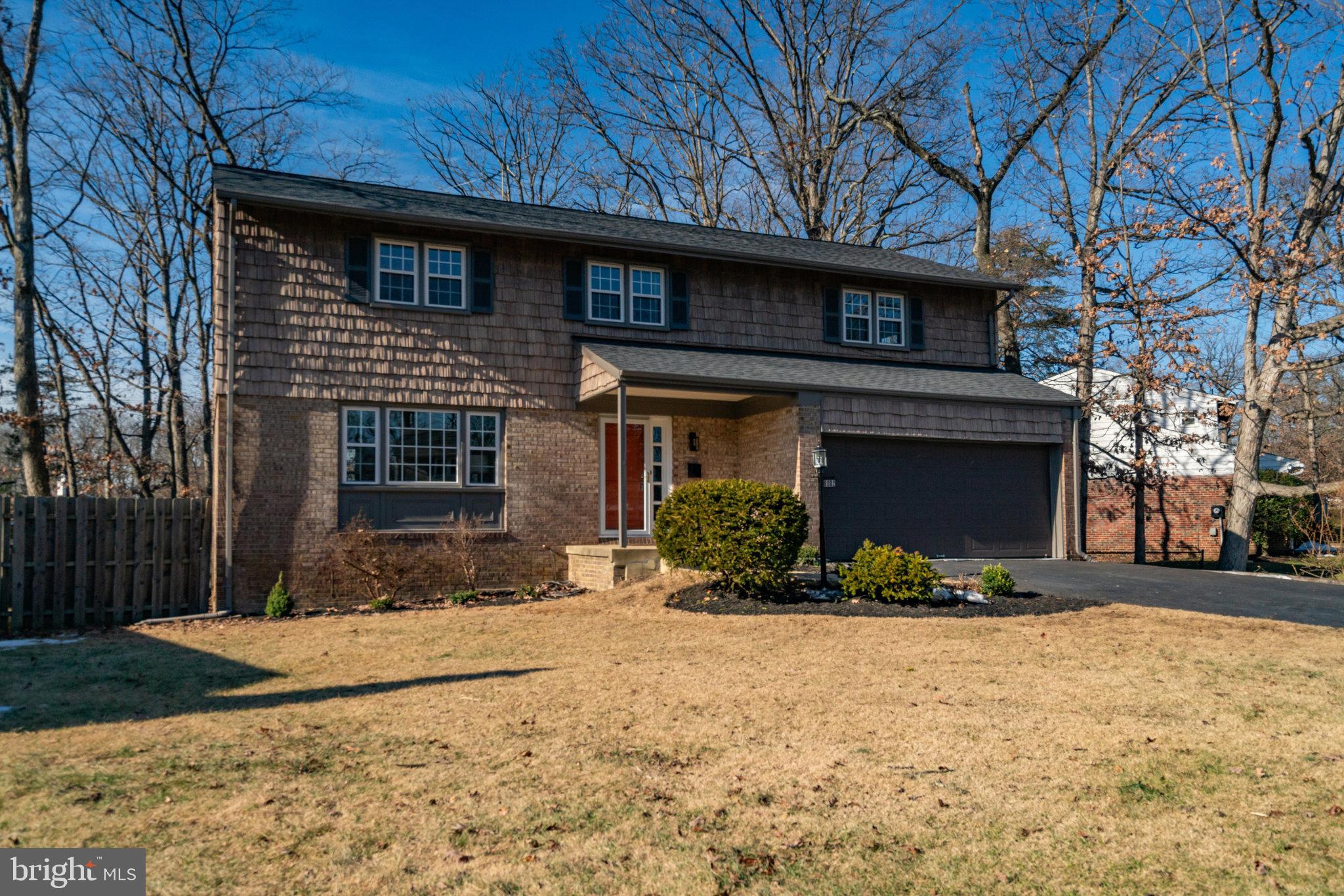 6002 Sherborn Lane Springfield, VA 22152 - Photo 3 of 52 a front view of a house with a yard