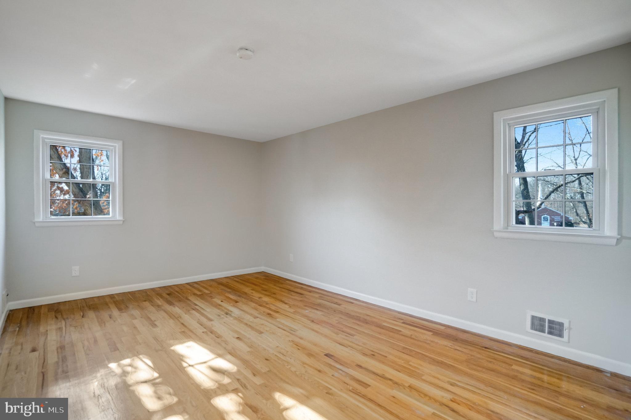 6002 Sherborn Lane Springfield, VA 22152 - Photo 37 of 52 a view of an empty room with wooden floor and a window
