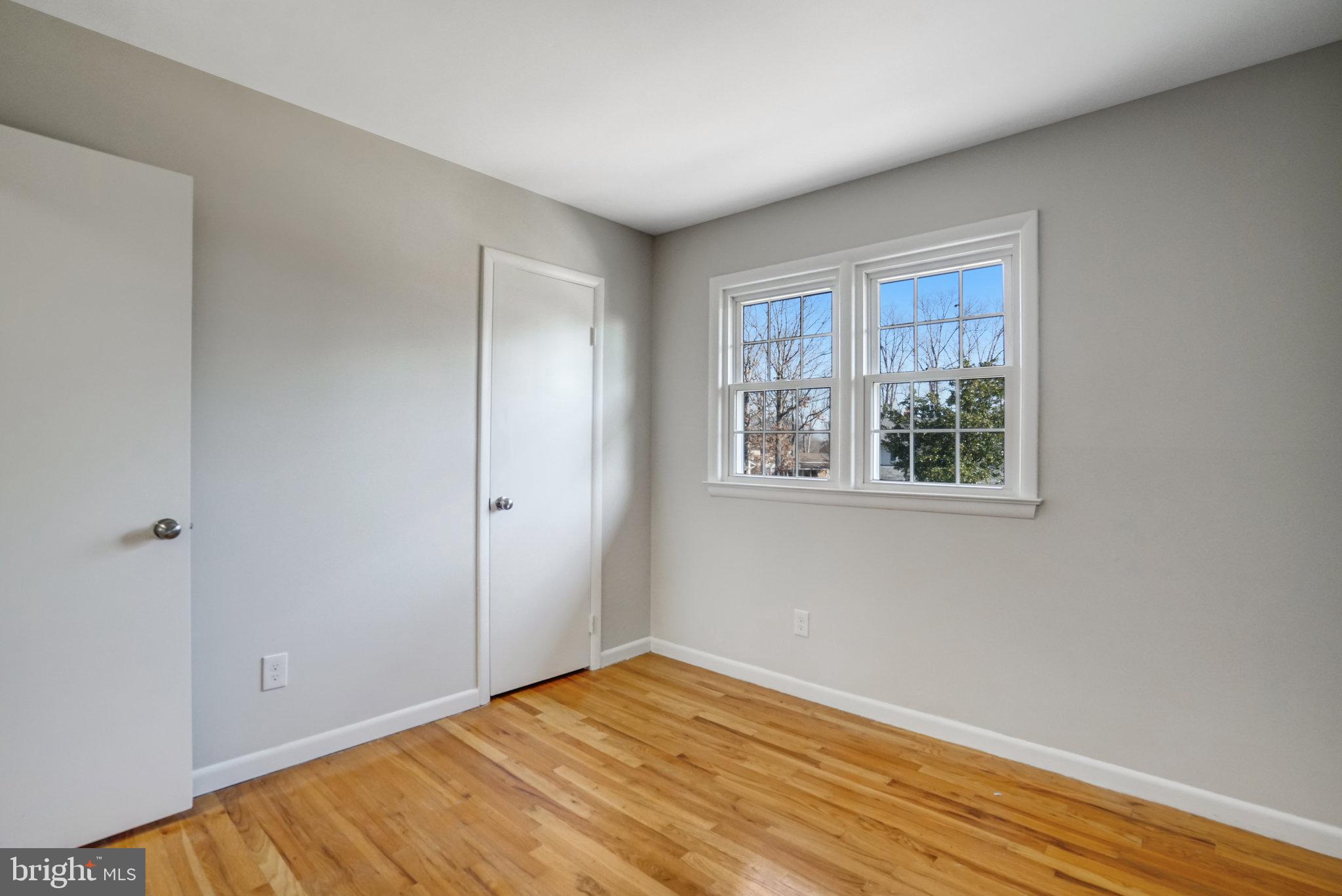 6002 Sherborn Lane Springfield, VA 22152 - Photo 43 of 52 a view of empty room with wooden floor and fan