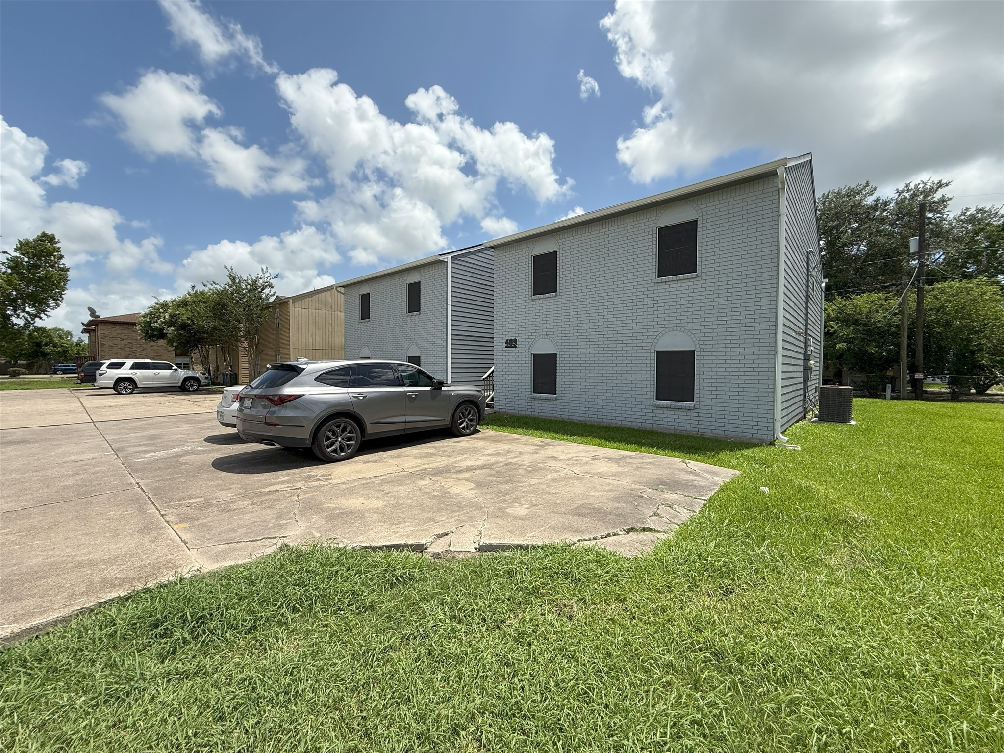 409 Bauer Drive Port Lavaca, TX 77979 - Photo 1 of 13 a car parked in front of house