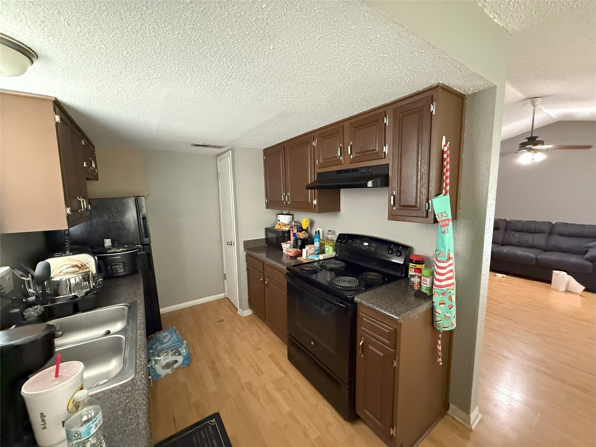 409 Bauer Drive Port Lavaca, TX 77979 - Photo 10 of 13 a kitchen with stainless steel appliances granite countertop a stove refrigerator and a sink