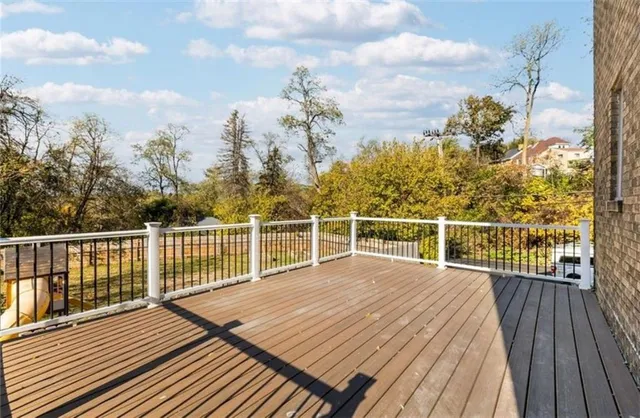 a view of a balcony with wooden floor