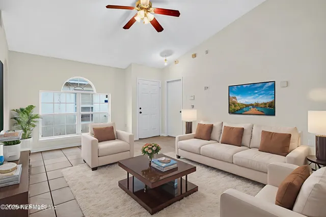 a living room with furniture and a rug