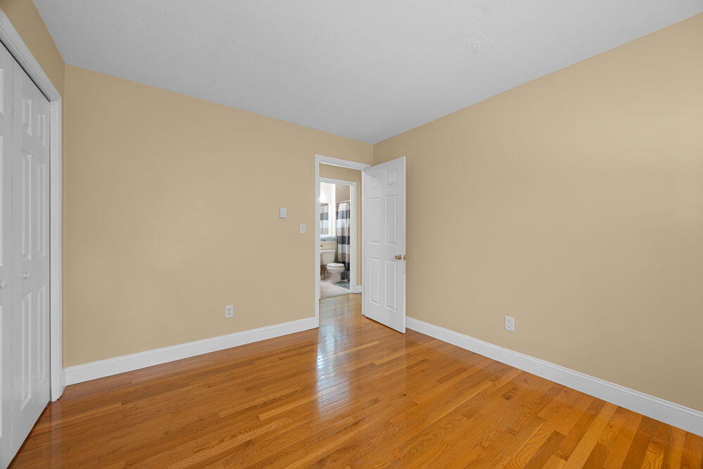 800 Bearses Way, Unit 1WD Hyannis, MA 02601 - Photo 15 of 24 a view of an empty room with wooden floor