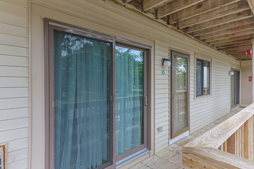 800 Bearses Way, Unit 1WD Hyannis, MA 02601 - Photo 19 of 24 a view of a porch with wooden floor and stairs