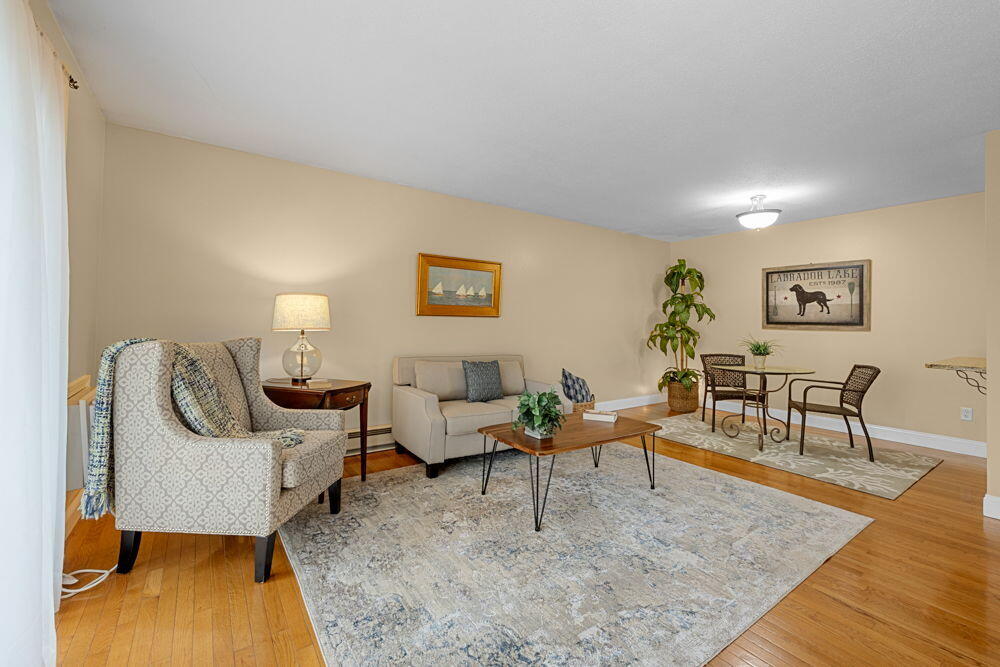 800 Bearses Way, Unit 1WD Hyannis, MA 02601 - Photo 2 of 24 a living room with furniture and a couch