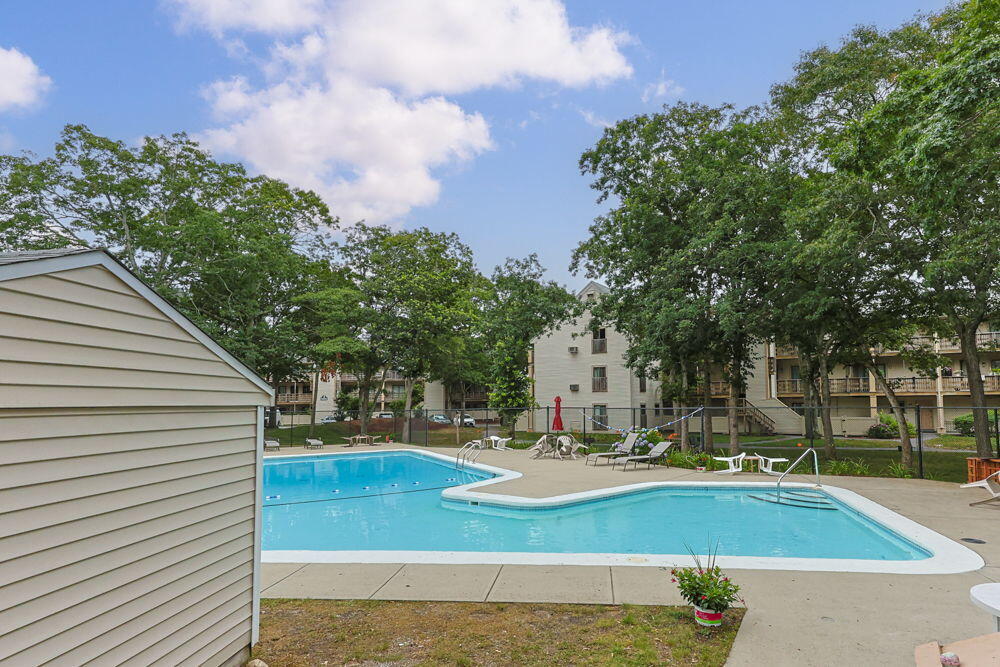 800 Bearses Way, Unit 1WD Hyannis, MA 02601 - Photo 21 of 24 a view of a fountain in the backyard of house