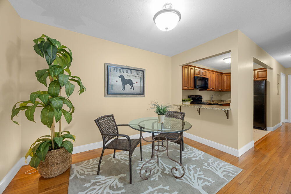 800 Bearses Way, Unit 1WD Hyannis, MA 02601 - Photo 5 of 24 a view of a livingroom with furniture and a potted plant
