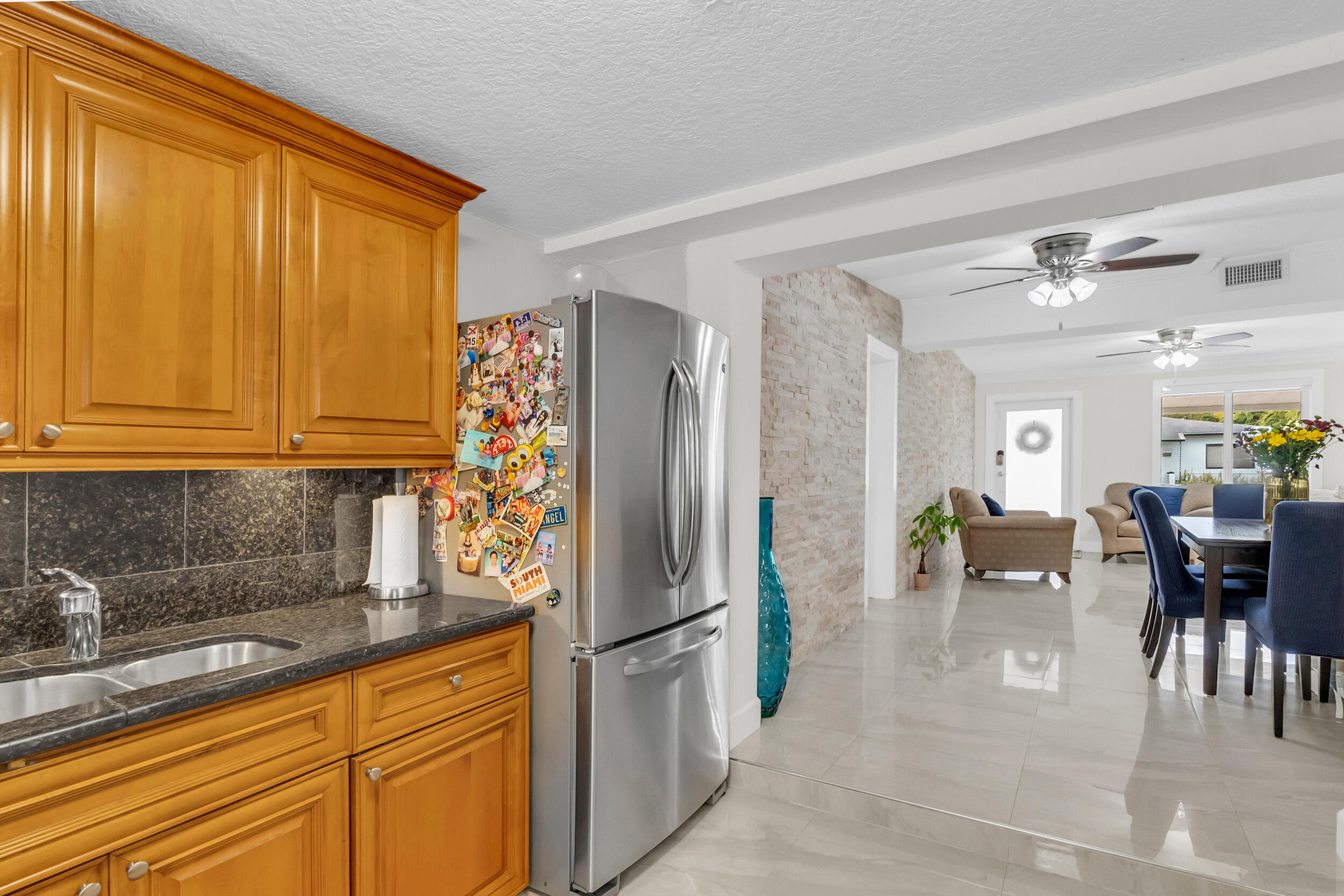 6350 Southwest 32nd Street Miami, FL 33155 - Photo 13 of 34 a kitchen with stainless steel appliances granite countertop a refrigerator and a sink