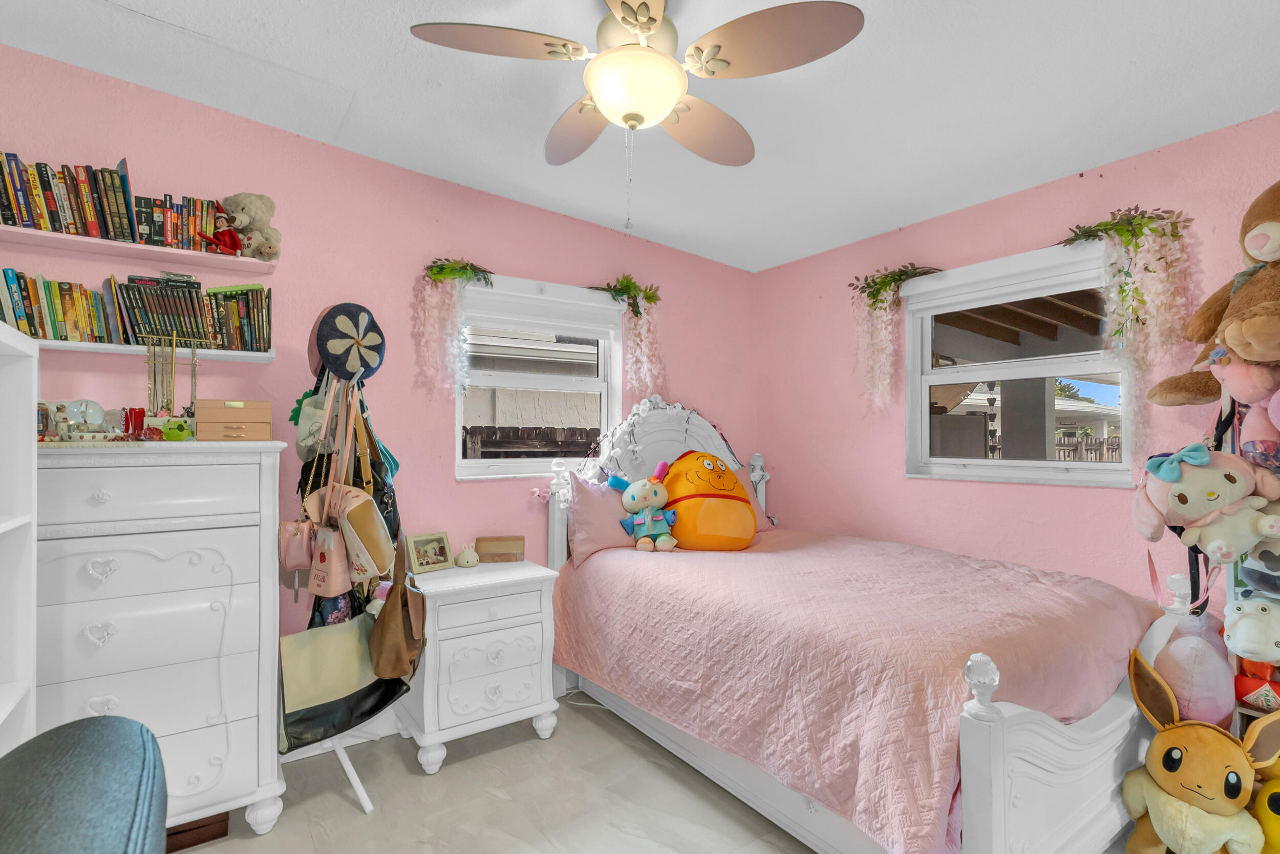 6350 Southwest 32nd Street Miami, FL 33155 - Photo 20 of 34 a bedroom with a bed and a chandelier