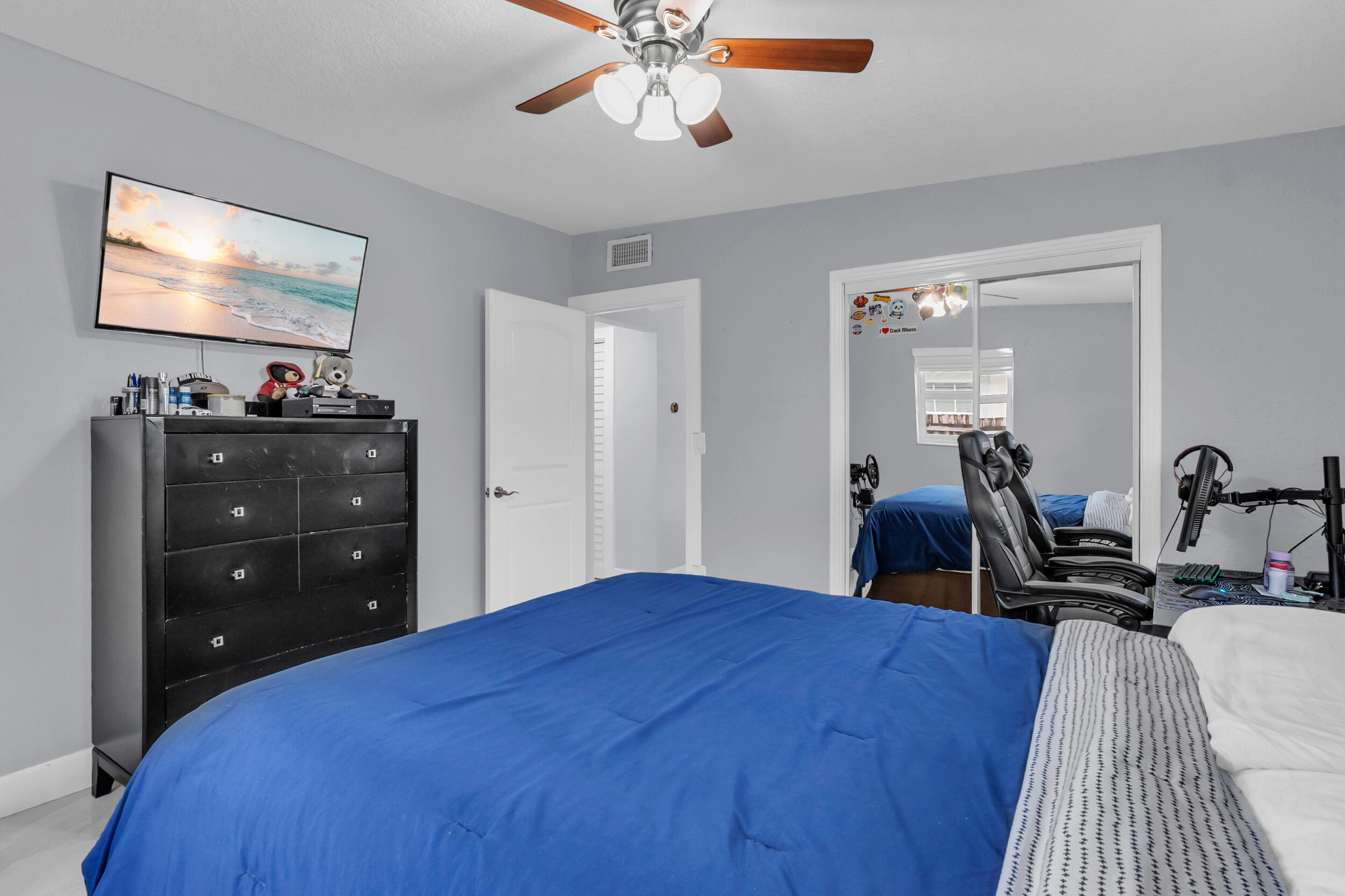 6350 Southwest 32nd Street Miami, FL 33155 - Photo 23 of 34 a bedroom with a bed and a flat tv screen on dresser