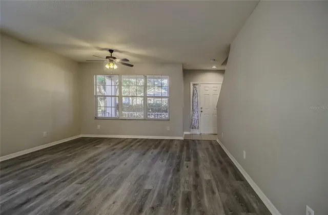 a bathroom with a granite countertop toilet a sink and bathtub