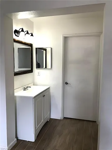 a bathroom with a sink and mirror