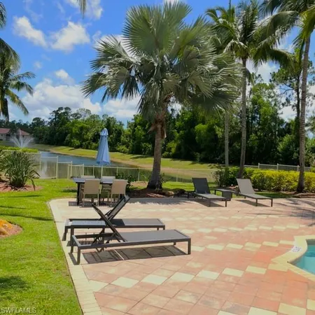 a view of a table and chairs in the garden