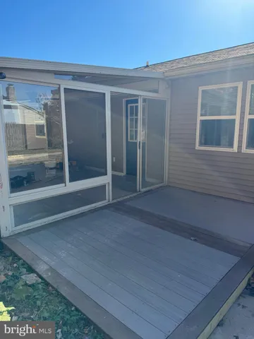 a view of backyard and front door
