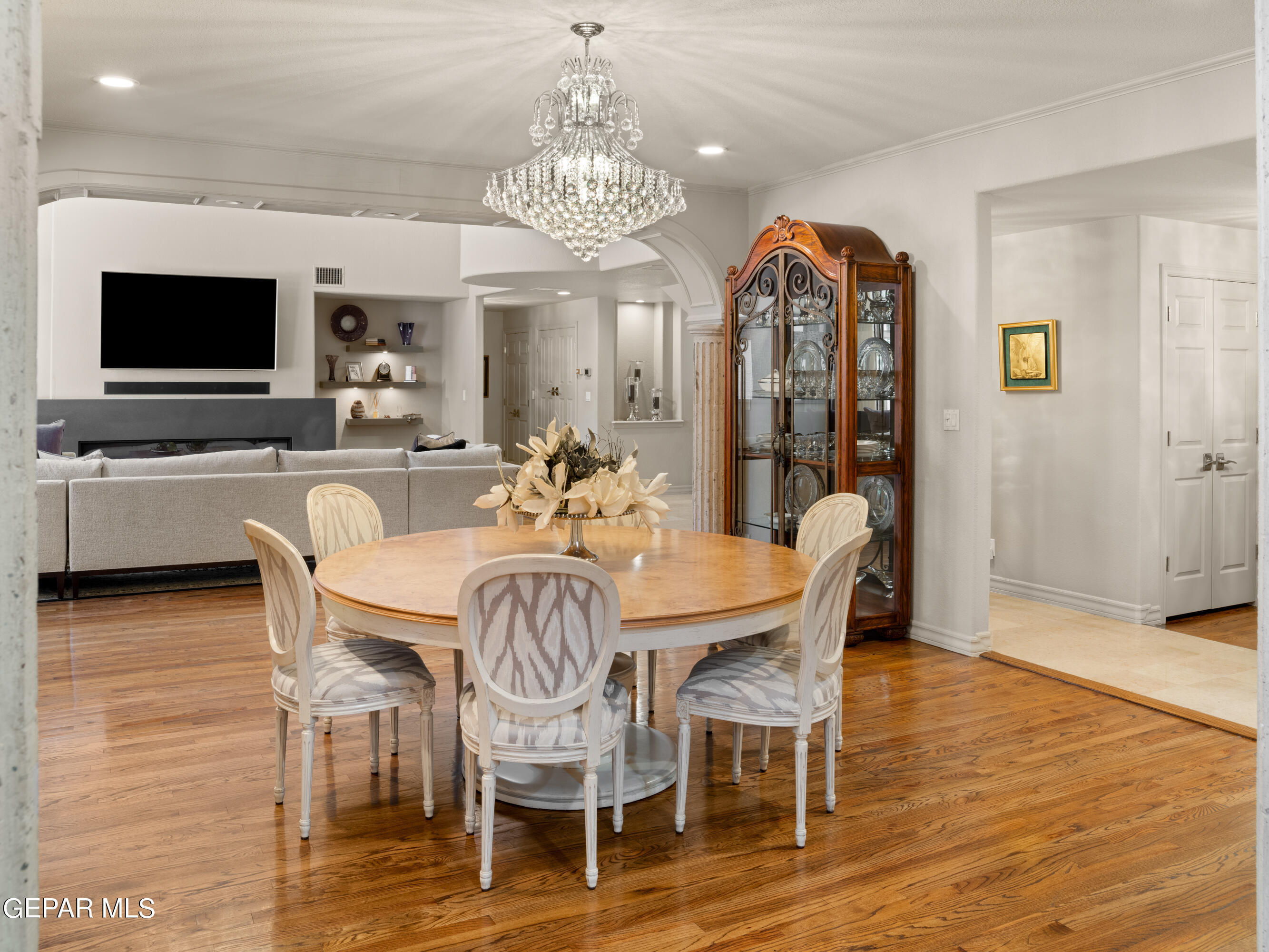 813 Rosinante Road El Paso, TX 79922 - Photo 20 of 67 a view of a dining room with furniture wooden floor and chandelier