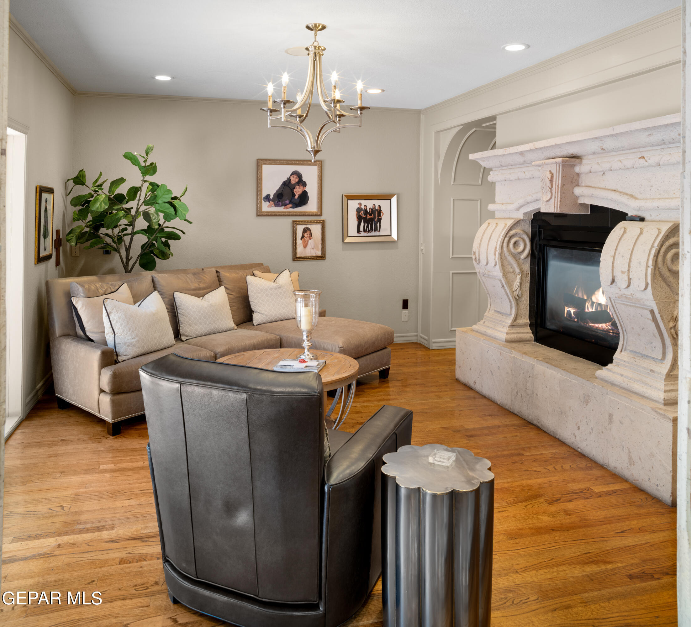 813 Rosinante Road El Paso, TX 79922 - Photo 24 of 67 a living room with furniture and a chandelier