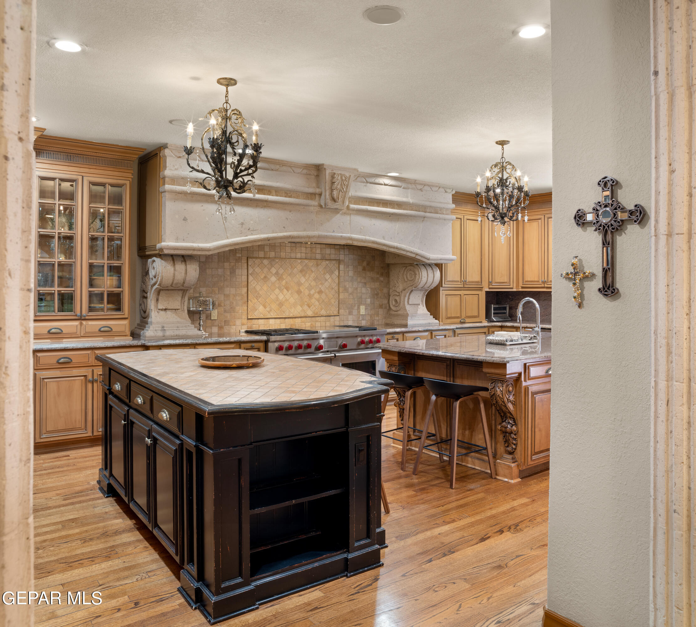 813 Rosinante Road El Paso, TX 79922 - Photo 26 of 67 a kitchen with a stove and a refrigerator