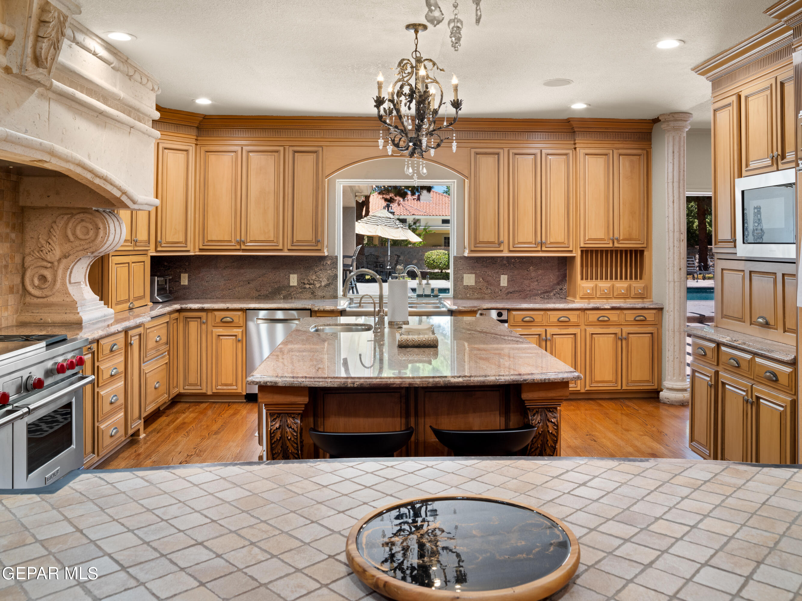 813 Rosinante Road El Paso, TX 79922 - Photo 28 of 67 a kitchen with stainless steel appliances granite countertop a sink dishwasher stove and refrigerator