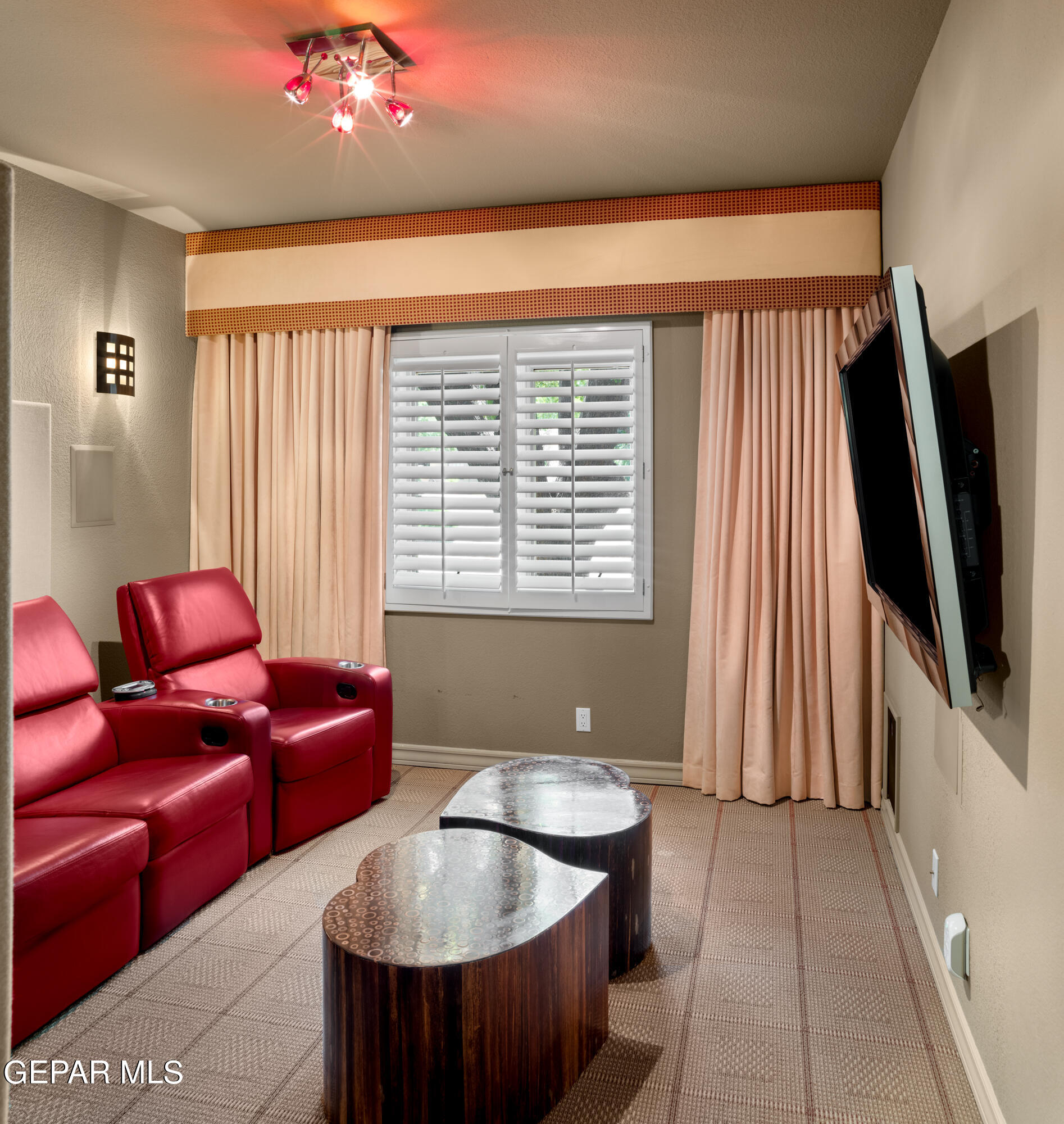 813 Rosinante Road El Paso, TX 79922 - Photo 30 of 67 a living room with furniture and a flat screen tv