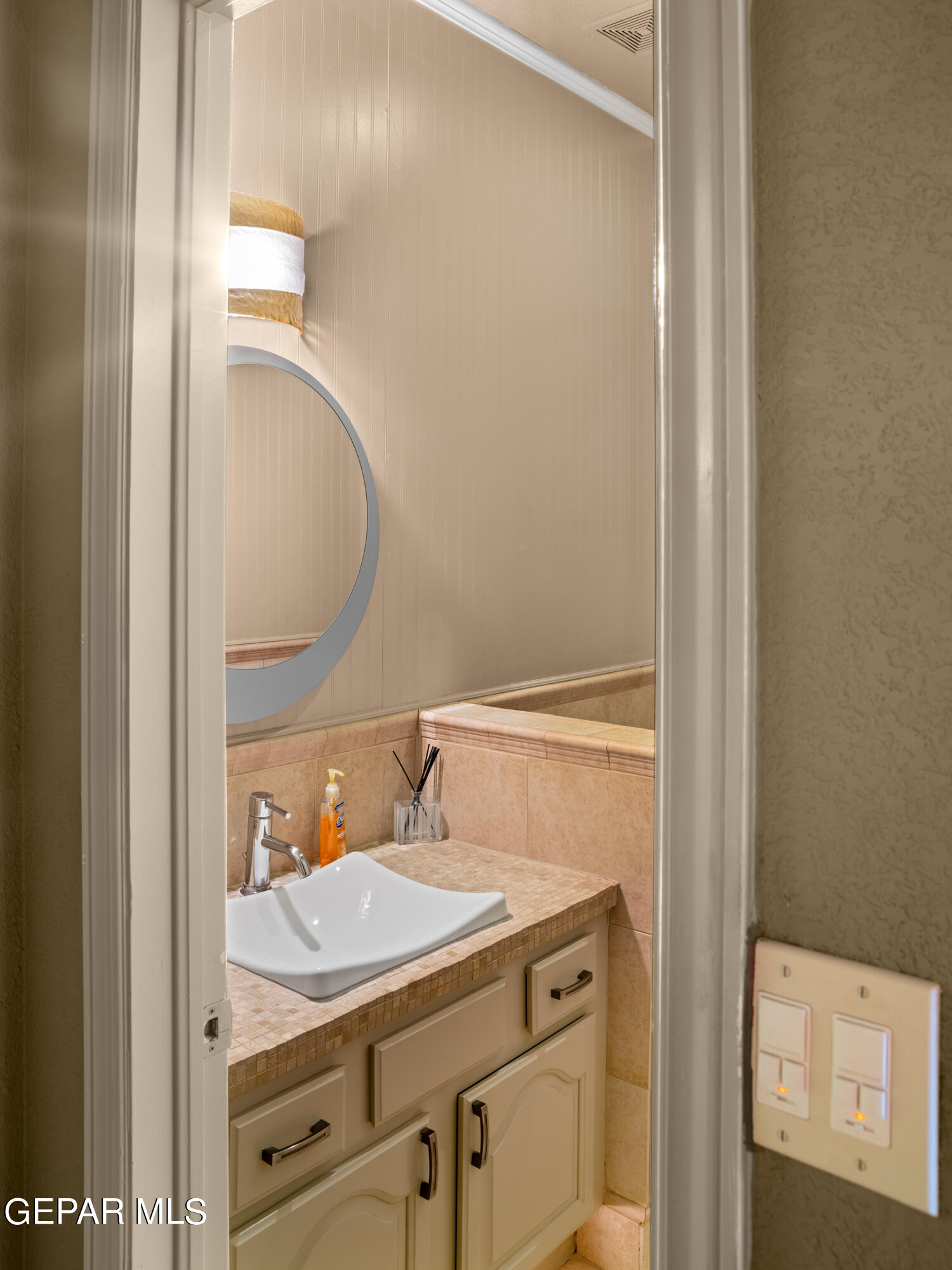813 Rosinante Road El Paso, TX 79922 - Photo 31 of 67 a bathroom with a sink and a mirror