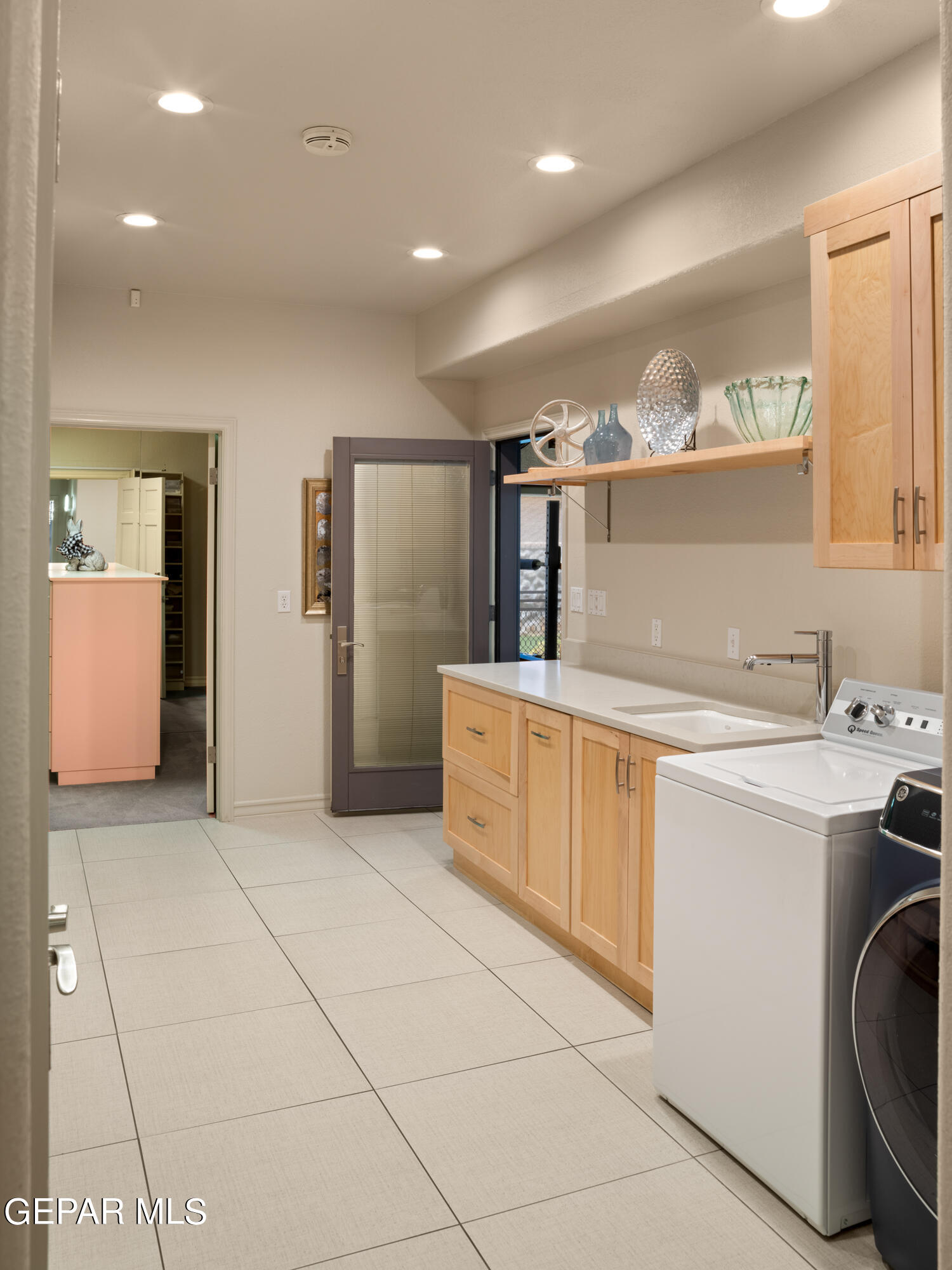 813 Rosinante Road El Paso, TX 79922 - Photo 32 of 67 a kitchen with a sink a stove cabinets and counter space